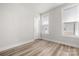 Minimalist bedroom design with hardwood floors, bright windows, and a neutral color palette for a serene feel at 3223 Beans Blvd, Charlotte, NC 28203