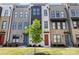 Modern townhome exteriors showcase brick and siding, with colorful doors and lush landscaping at 3223 Beans Blvd, Charlotte, NC 28203