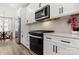 Modern kitchen features stainless steel appliances, white cabinetry and plenty of countertop space at 3223 Beans Blvd, Charlotte, NC 28203