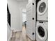 Convenient laundry area with stacked washer and dryer near the staircase at 3223 Beans Blvd, Charlotte, NC 28203
