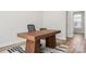 Office space featuring a large wooden desk, neutral walls, and bright natural light at 3223 Beans Blvd, Charlotte, NC 28203