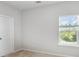 Bedroom featuring neutral carpet, a window with blinds, and a closet door at 338 Livingston Dr, Lancaster, SC 29720