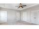 Bedroom featuring a ceiling fan, natural light, and multiple closet doors at 338 Livingston Dr, Lancaster, SC 29720