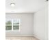 Bright bedroom featuring neutral carpet, a window with blinds and a modern ceiling light at 338 Livingston Dr, Lancaster, SC 29720