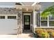 Charming home featuring a stone facade, a welcoming front door, and an attached white garage at 338 Livingston Dr, Lancaster, SC 29720