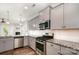 Modern kitchen featuring stainless steel appliances, gray cabinets, and beautiful granite countertops at 338 Livingston Dr, Lancaster, SC 29720