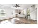 Bright and airy living room open to the kitchen, featuring wood floors and abundant natural light at 338 Livingston Dr, Lancaster, SC 29720