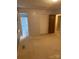 Bedroom with view to the bathroom and large closet with neutral walls and carpeted floors at 3498 Yorkland Dr, Hickory, NC 28601