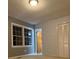 Bedroom featuring neutral walls, carpeted flooring, and natural light from two windows at 3498 Yorkland Dr, Hickory, NC 28601