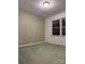 Bedroom with green carpeting, neutral walls, and windows with lots of natural light at 3498 Yorkland Dr, Hickory, NC 28601