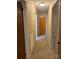 Hallway with neutral carpet leads to bedrooms and other rooms in this cozy home at 3498 Yorkland Dr, Hickory, NC 28601