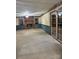 A spacious living room with a decorative brick fireplace, wainscoting, sliding door and two large windows at 3498 Yorkland Dr, Hickory, NC 28601