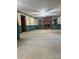 A spacious living room with a decorative brick fireplace, wainscoting, and two large windows at 3498 Yorkland Dr, Hickory, NC 28601