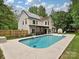 Backyard with an in-ground pool, patio area, and privacy fence at 3612 Woodnotch Ct, Charlotte, NC 28269