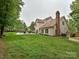 Spacious backyard with a well-maintained lawn, in-ground pool, and patio area at 3612 Woodnotch Ct, Charlotte, NC 28269