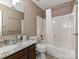 Cozy bathroom showcasing a vanity with marble countertops, a toilet, and a shower-tub combination at 3612 Woodnotch Ct, Charlotte, NC 28269