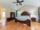 Comfortable bedroom featuring hardwood floors and a queen-size bed, perfect for relaxation at 3612 Woodnotch Ct, Charlotte, NC 28269