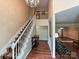 Grand foyer with elegant staircase and views to living spaces at 3612 Woodnotch Ct, Charlotte, NC 28269