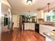 Bright kitchen featuring granite countertops, stainless steel appliances, and hardwood flooring at 3612 Woodnotch Ct, Charlotte, NC 28269