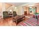 Cozy living room with hardwood floors, wainscoting, and lots of natural light at 3612 Woodnotch Ct, Charlotte, NC 28269