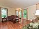 Inviting living room with hardwood floors, large windows, and neutral decor at 3612 Woodnotch Ct, Charlotte, NC 28269