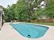 In-ground pool featuring a robot cleaner and surrounded by lush greenery and a patio at 3612 Woodnotch Ct, Charlotte, NC 28269
