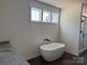 Relax in this luxurious bathroom featuring a standalone tub and a glass-enclosed shower at 4034 Daugherty Rd, China Grove, NC 28023