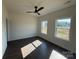 Sun-filled bedroom with two windows offers a serene and comfortable living space at 4034 Daugherty Rd, China Grove, NC 28023