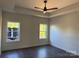 This bedroom boasts a ceiling fan and lots of natural light from the many windows at 4034 Daugherty Rd, China Grove, NC 28023