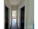 Bright hallway with open doors to closets at 4034 Daugherty Rd, China Grove, NC 28023