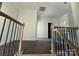 Upstairs landing with hardwood floors, wood railing and molding at 4034 Daugherty Rd, China Grove, NC 28023