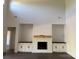 Bright living room featuring a modern fireplace, built-in shelving, and high ceilings at 4034 Daugherty Rd, China Grove, NC 28023