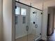 Stylish bathroom shower with white tile, and black hardware and accents at 4034 Daugherty Rd, China Grove, NC 28023