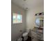 Bathroom featuring a granite countertop, modern lighting, and a window for natural light at 4040 Daugherty Rd, China Grove, NC 28023