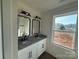 Bathroom featuring double sink vanity with granite countertop and modern fixtures at 4040 Daugherty Rd, China Grove, NC 28023