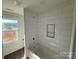 New bathroom showcasing tub with white subway tile surround and niche at 4040 Daugherty Rd, China Grove, NC 28023