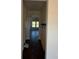 Hallway with a sliding barn door, dark hardwood floors, and natural light from large windows at 4040 Daugherty Rd, China Grove, NC 28023