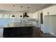 Kitchen with a large island, granite countertops, modern lighting, and ample cabinet space at 4040 Daugherty Rd, China Grove, NC 28023