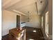 Spacious living room with elegant trey ceiling, decorative light fixture and new wood flooring at 4040 Daugherty Rd, China Grove, NC 28023