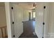 Spacious main bedroom with tray ceiling, ceiling fan, and multiple windows providing ample natural light at 4040 Daugherty Rd, China Grove, NC 28023