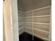 Pantry with white shelving and dark-colored floors at 4040 Daugherty Rd, China Grove, NC 28023