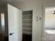 Walk-in pantry featuring wood shelving for optimal storage space at 4040 Daugherty Rd, China Grove, NC 28023