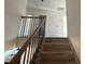 Staircase leading to upper level, featuring wood and metal railing at 4040 Daugherty Rd, China Grove, NC 28023