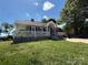 Charming single-story home with a welcoming front porch and well-maintained landscaping, offering classic curb appeal at 406 S Catawba St, Lancaster, SC 29720