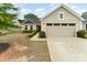 Charming single-Gathering home with light siding, a two-car garage, and manicured landscaping at 4219 Mackinnon Dr, Charlotte, NC 28214