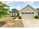 Charming single-Gathering home with light siding, a two-car garage, and manicured landscaping at 4219 Mackinnon Dr, Charlotte, NC 28214