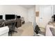 Functional home office area featuring a large desk, storage, and modern amenities for remote work or study at 4219 Mackinnon Dr, Charlotte, NC 28214