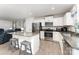 Modern kitchen features stainless steel appliances, granite countertops, and a convenient breakfast bar with seating at 4219 Mackinnon Dr, Charlotte, NC 28214