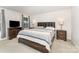 Comfortable main bedroom with a large bed, dark wood furniture, and ample natural light from the window at 4219 Mackinnon Dr, Charlotte, NC 28214