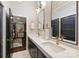 Stylish bathroom with a double sink vanity, sleek lighting, and a view into the bedroom, blending functionality and style at 423 N Pine St, Charlotte, NC 28202